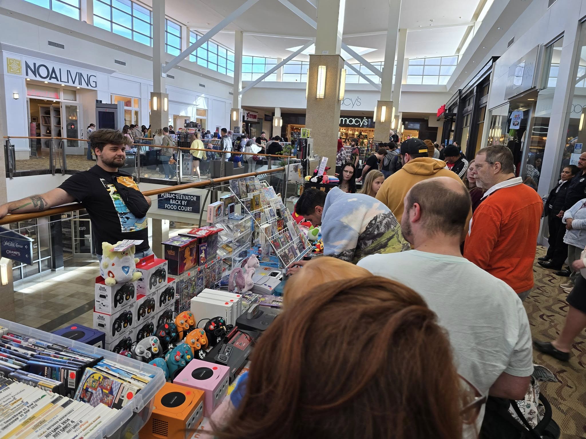 Vendor chatting with a customer at a Raleigh Retro Gamers market