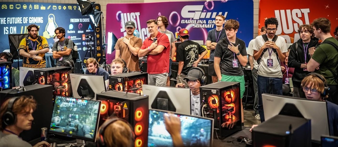 Attendees browsing vendor tables at a Raleigh Retro Gamers market